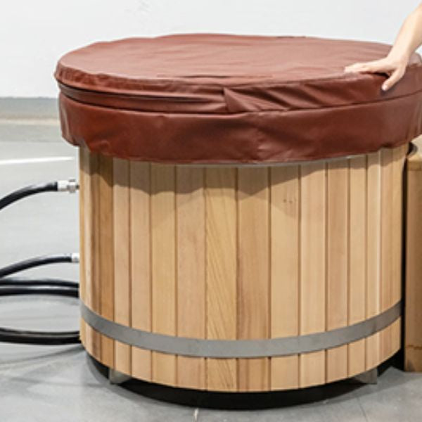 Wooden barrel cold plunge tub with water chiller system, showcasing modern cold therapy setup for home use