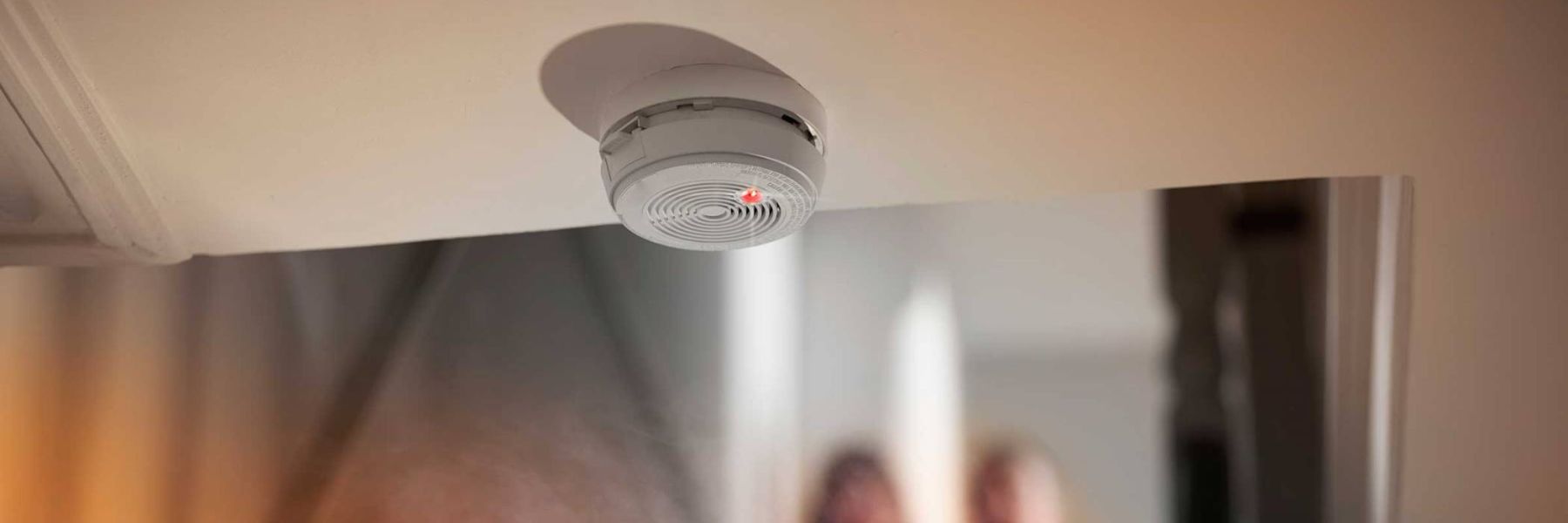 Smoke detector on ceiling potentially triggered by steam from hot shower