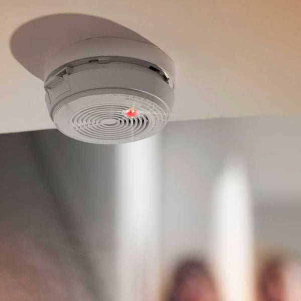 Smoke detector on ceiling potentially triggered by steam from hot shower