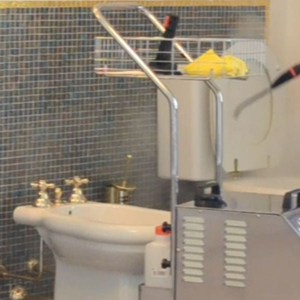 Professional using industrial steam cleaner to sanitise bathroom and steam shower surfaces