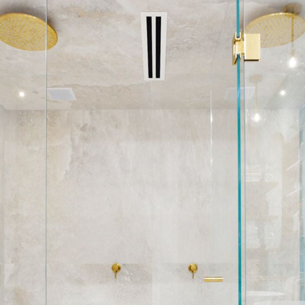 Modern steam shower with glass enclosure and rainfall showerhead in luxury bathroom