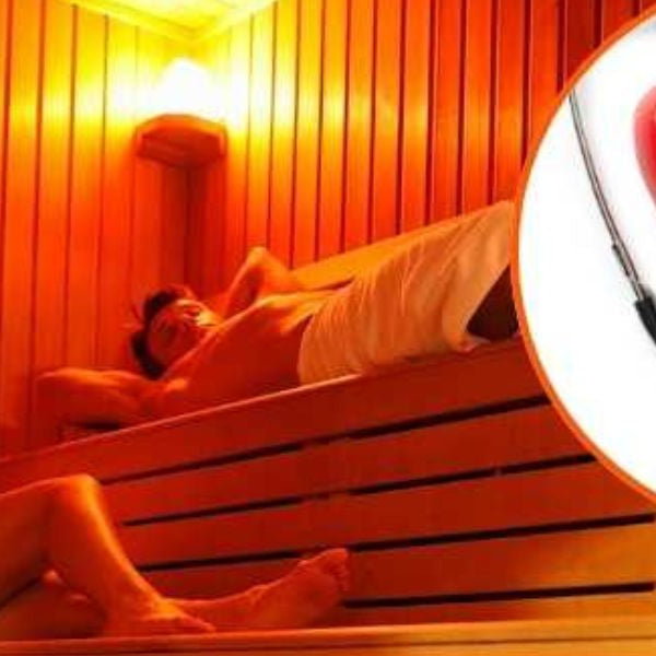 Couple relaxing in sauna with heart health concept, illustrating cardiovascular benefits of heat therapy