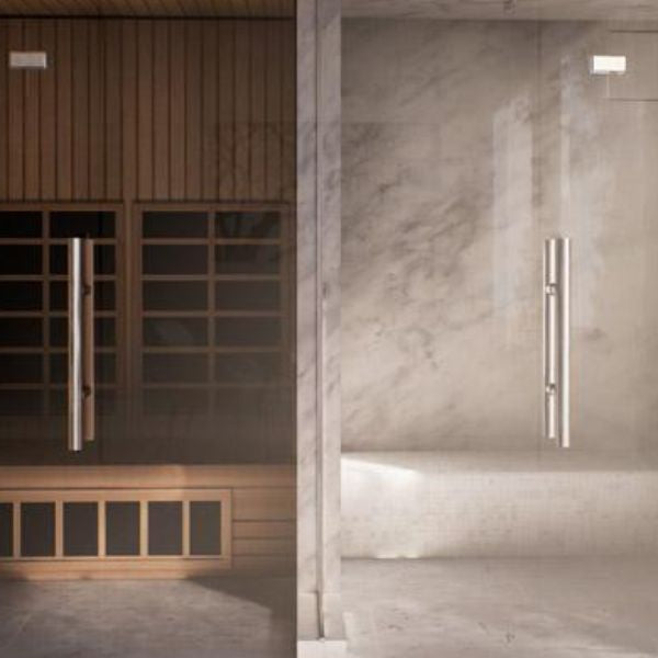Modern home wellness setup featuring infrared sauna cabin beside a glass steam shower room