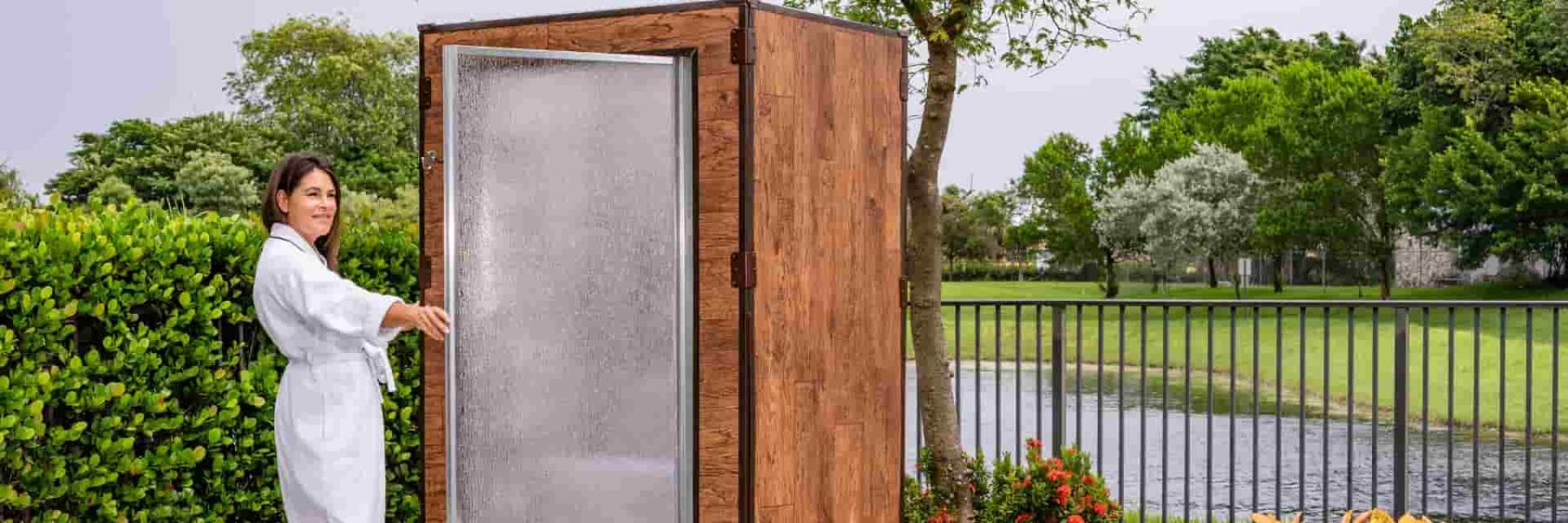 Outdoor steam shower cabin used for natural respiratory relief and relaxation in a garden setting