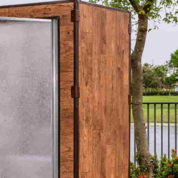 Outdoor steam shower cabin used for natural respiratory relief and relaxation in a garden setting