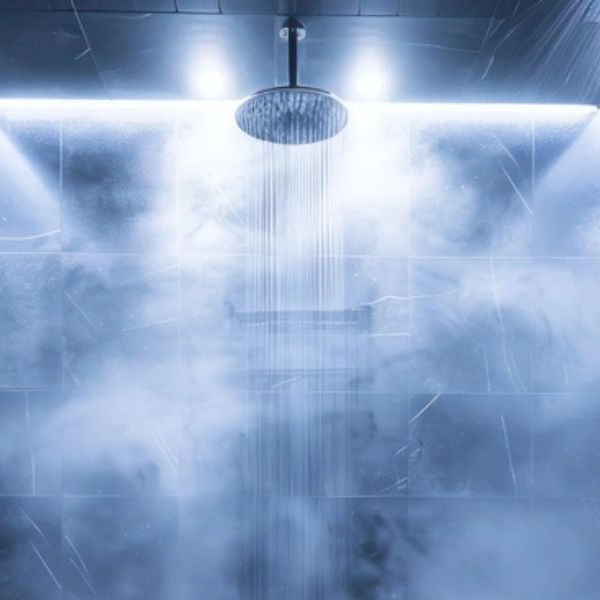 Contemporary steam shower with glass enclosure and rainfall head producing relaxing steam