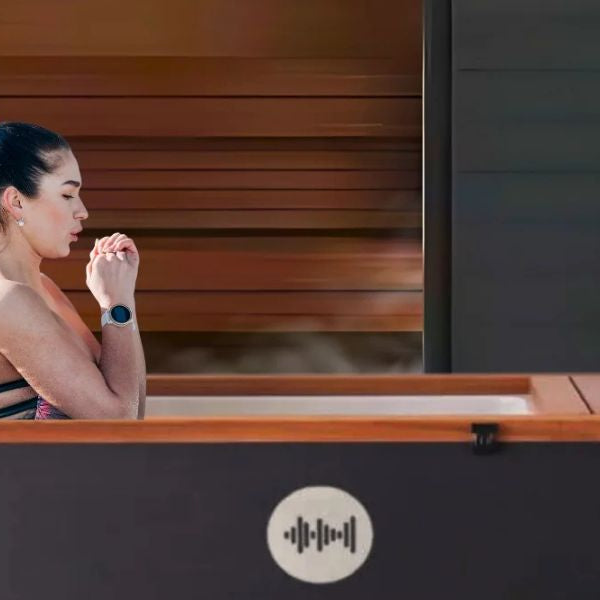 Athlete using cold plunge tub after sauna for contrast therapy recovery