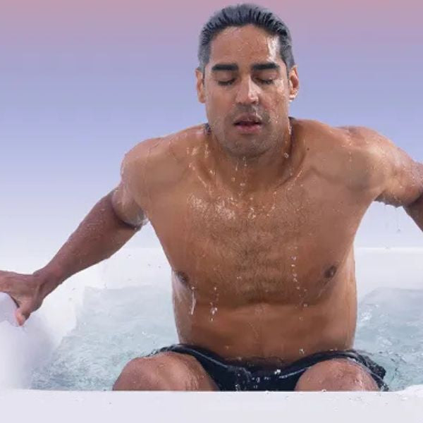 Athlete completing cold plunge recovery routine after exercise