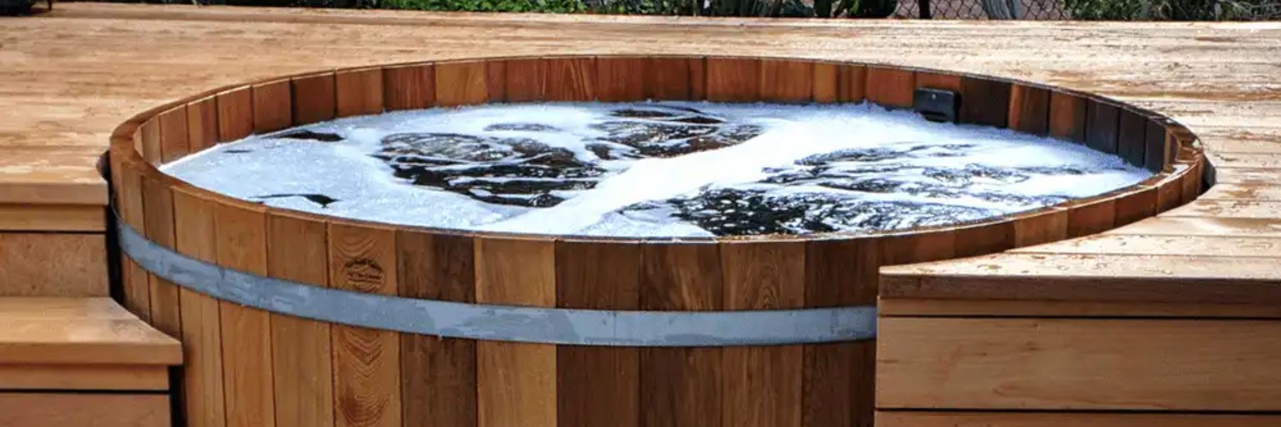 Traditional cedar cold plunge tub at a wellness retreat