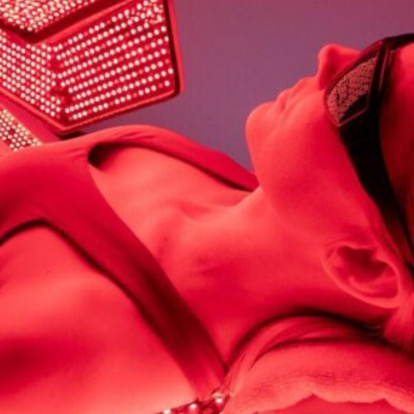 Woman undergoing full-body red light therapy session, demonstrating effective wavelengths for skin and recovery