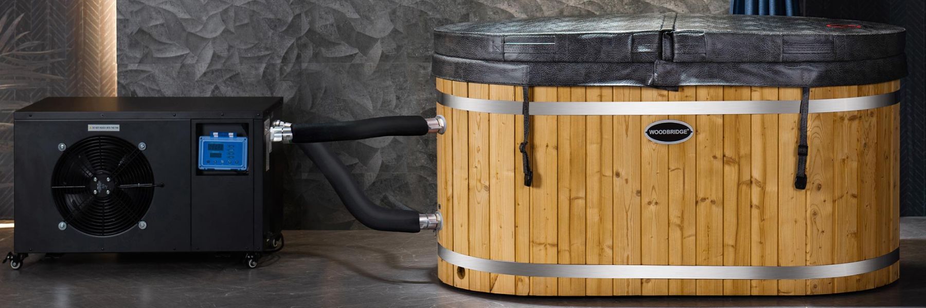 Modern cold plunge tub with integrated chiller and filtration system used for ice bath recovery therapy.