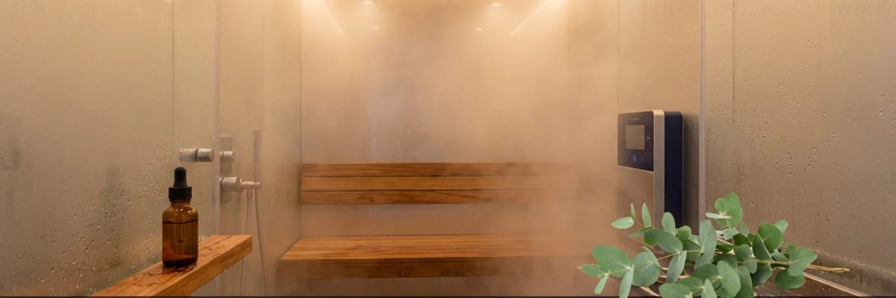 Modern steam shower interior with wooden bench and steam creating a relaxing spa-like environment