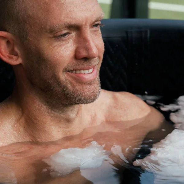 Athlete practising sauna and cold plunge recovery for metabolic health.