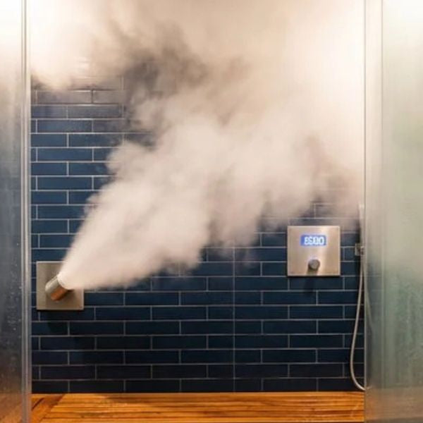 Luxury steam shower with visible steam output and seating in spa-style bathroom