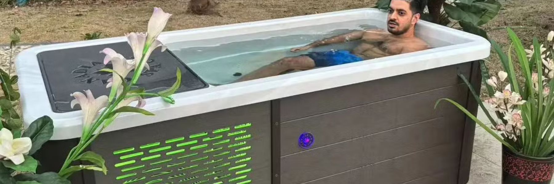 Premium cold plunge chiller connected to an outdoor ice bath tub in a modern home wellness garden recovery setup.
