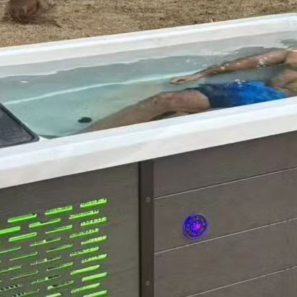 Premium cold plunge chiller connected to an outdoor ice bath tub in a modern home wellness garden recovery setup.