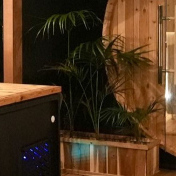 Outdoor sauna and cold plunge tub setup, showcasing hot and cold therapy routine for recovery and relaxation