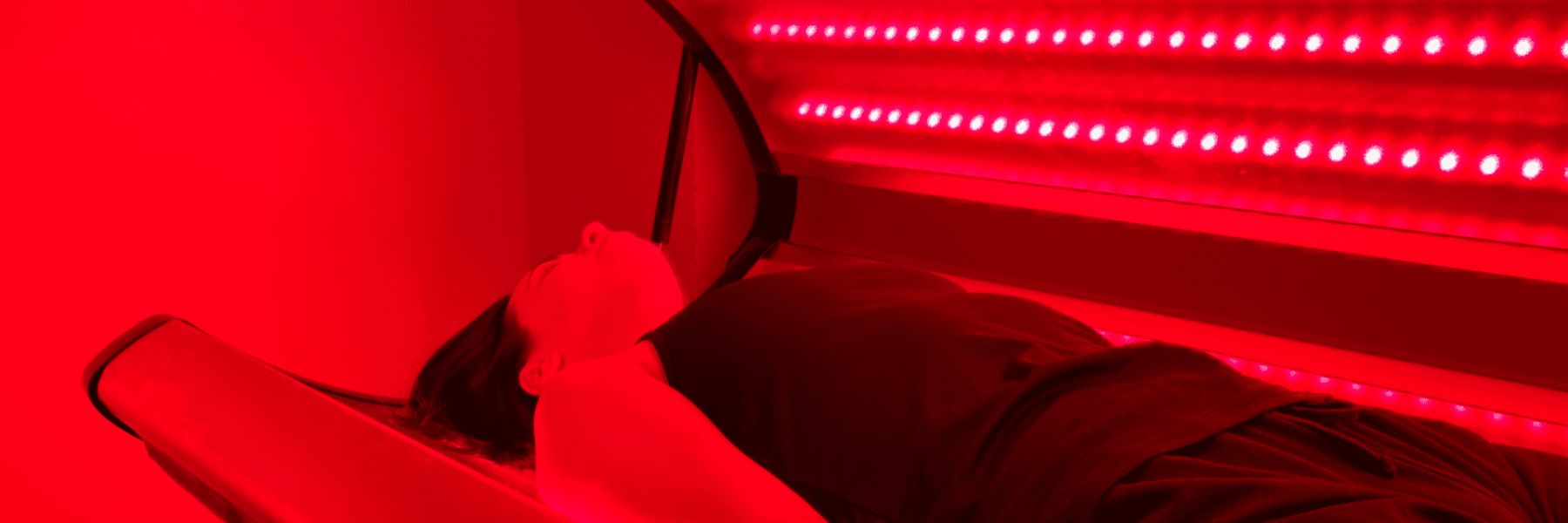 Woman exposed to intense red light therapy, demonstrating possible drawbacks and skin sensitivity risks