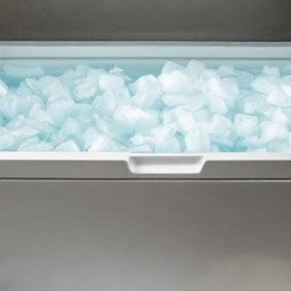 Chest freezer converted into a DIY ice bath tub filled with ice for cold plunge recovery