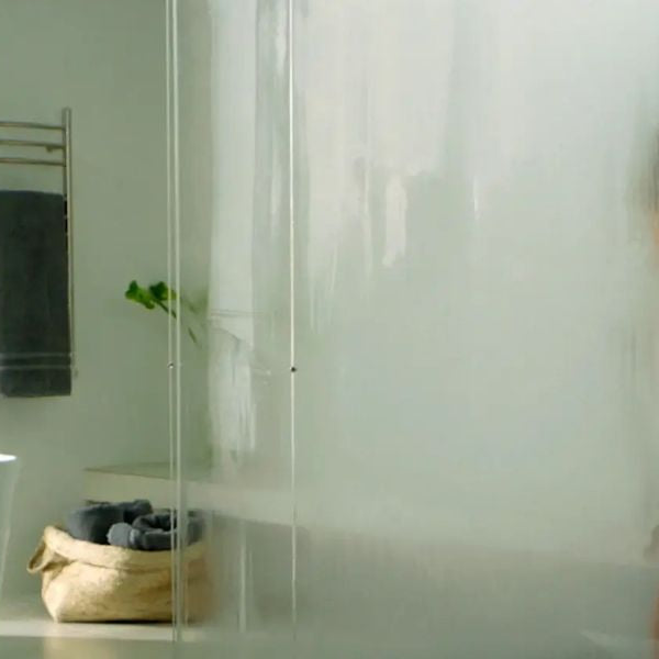 Modern steam shower with frosted glass and warm steam helping relieve cold and congestion symptoms