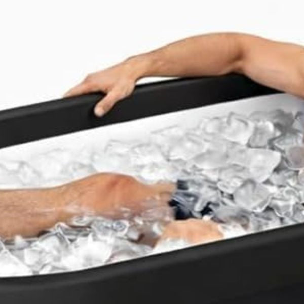 Modern cold plunge tub with ice water prepared for cold water immersion and recovery therapy.