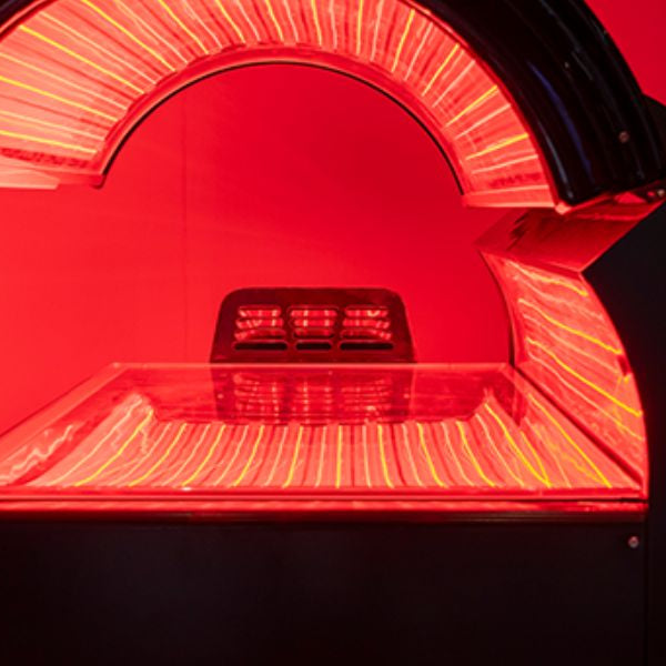 Professional red light therapy bed, illustrating ideal treatment frequency and session timing for best results