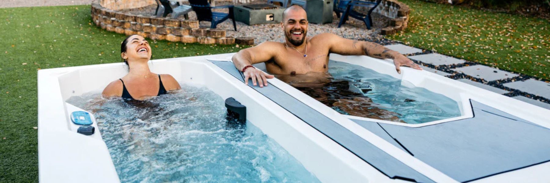 Person slowly entering a cold plunge tub outdoors while practising controlled breathing during an ice bath recovery session.