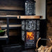 sauna stove with a visible fire burning inside