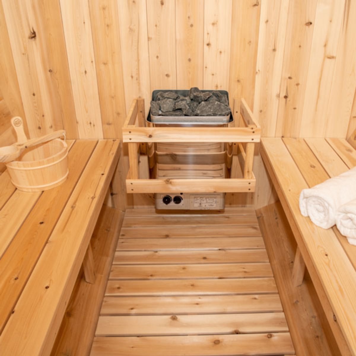 The Dundalk CT Harmony Wood Burning Barrel Sauna with an electric heater.