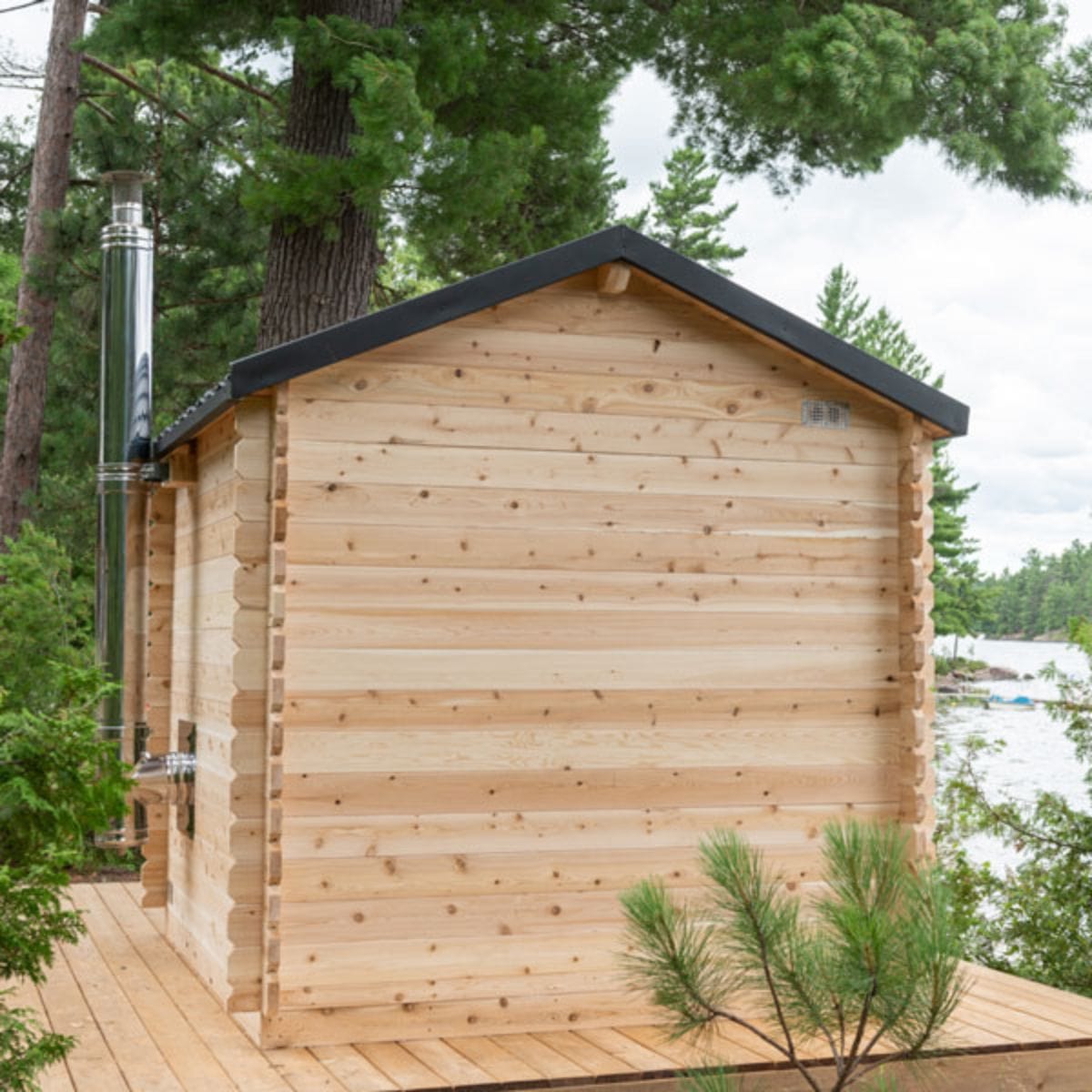 The Georgian Cabin Sauna with a built-in front porch is handcrafted by Leisurecraft from Eastern White Cedar is lighter in color
