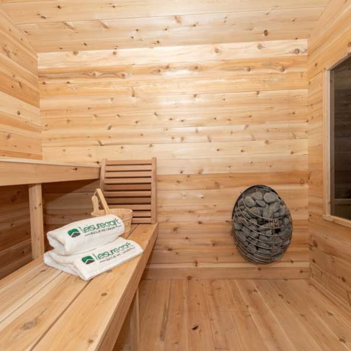 The Georgian Cabin Sauna with a built-in front porch is handcrafted by Leisurecraft from Eastern White Cedar is lighter in color