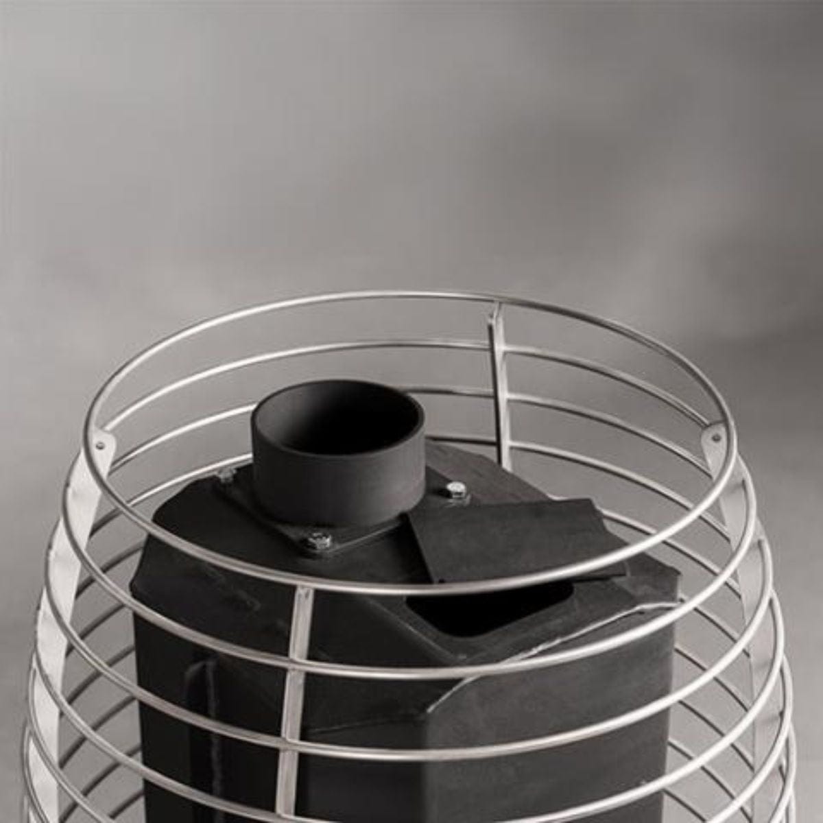 Ventilation system with black duct and metal grille on a gray background