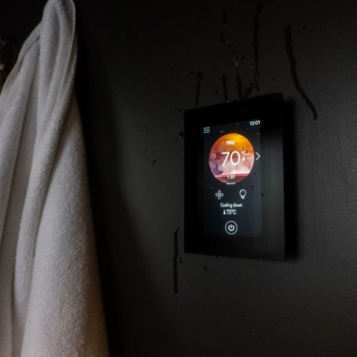 We recommend that you place the control panel near the sauna door as a surface installation or embedded into the wall