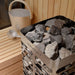 Heater with stones with 'Homecraft' branding on a wooden surface
