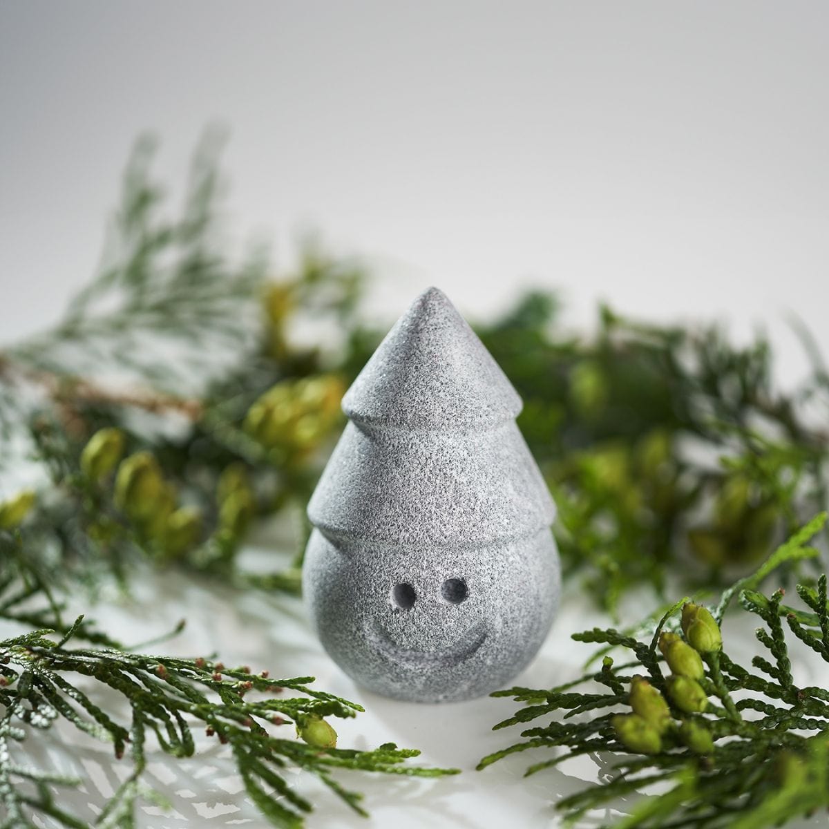 Fashioned with a stacked coned hat and a cheerful smile