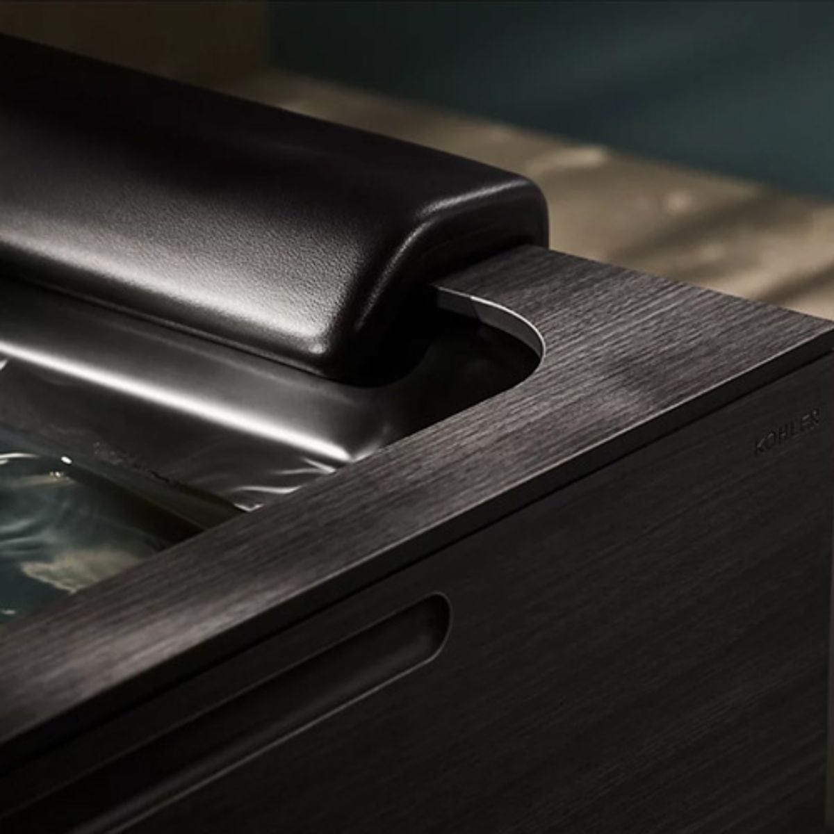 Close-up of a wooden surface with a metallic handle