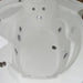 Close-up of a white hot tub with multiple jets.