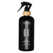 Black room scent spray bottle with a gold nozzle on a white background