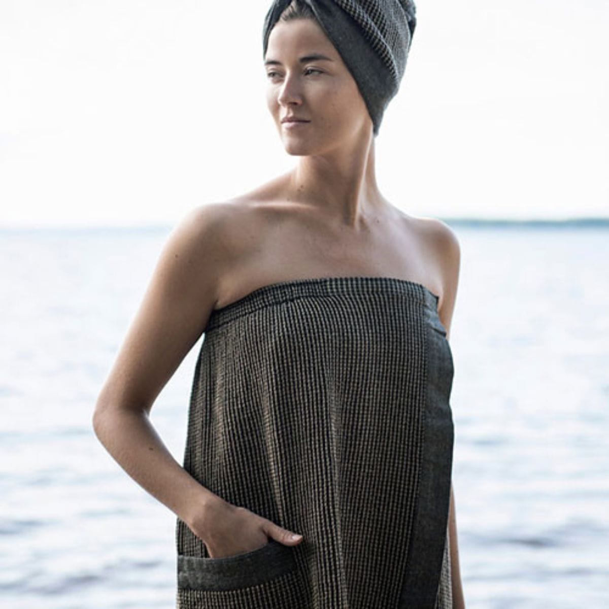 Woman wrapped in a sarong with a blurred background
