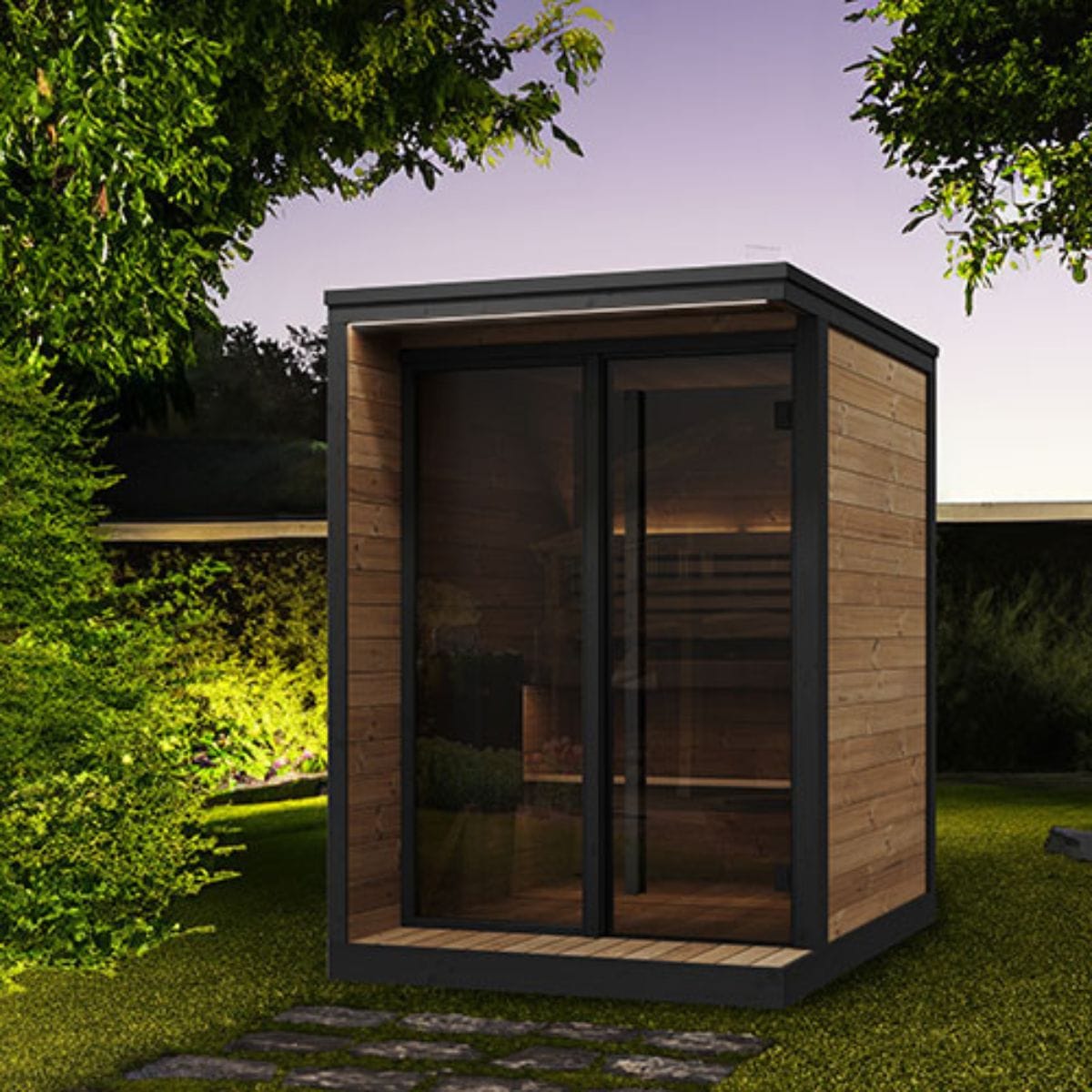 Modern outdoor cabin with wooden exterior and glass doors in a garden setting.