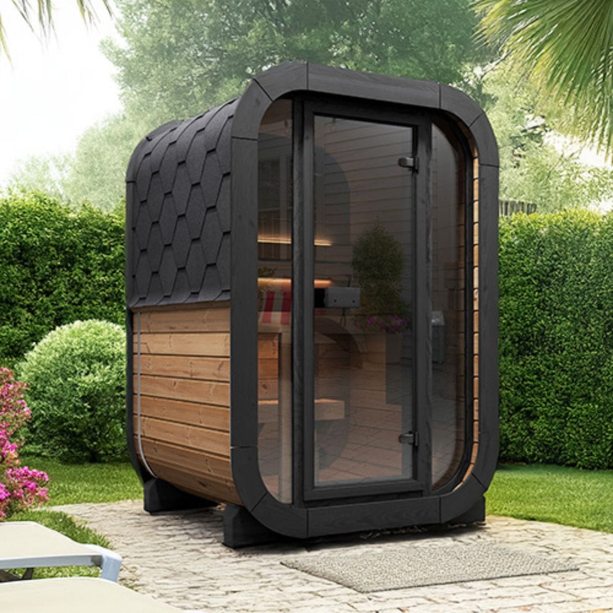 Modern outdoor office pod with wooden interior and glass walls, surrounded by greenery.