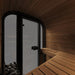 Wooden sauna interior with a glass door