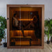 Dundalk CT Element Loft indoor sauna with two bathers behind the full-glass front
