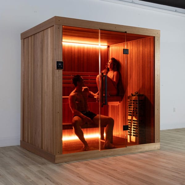 Two bathers inside the CT Element Studio, seen through the glass front